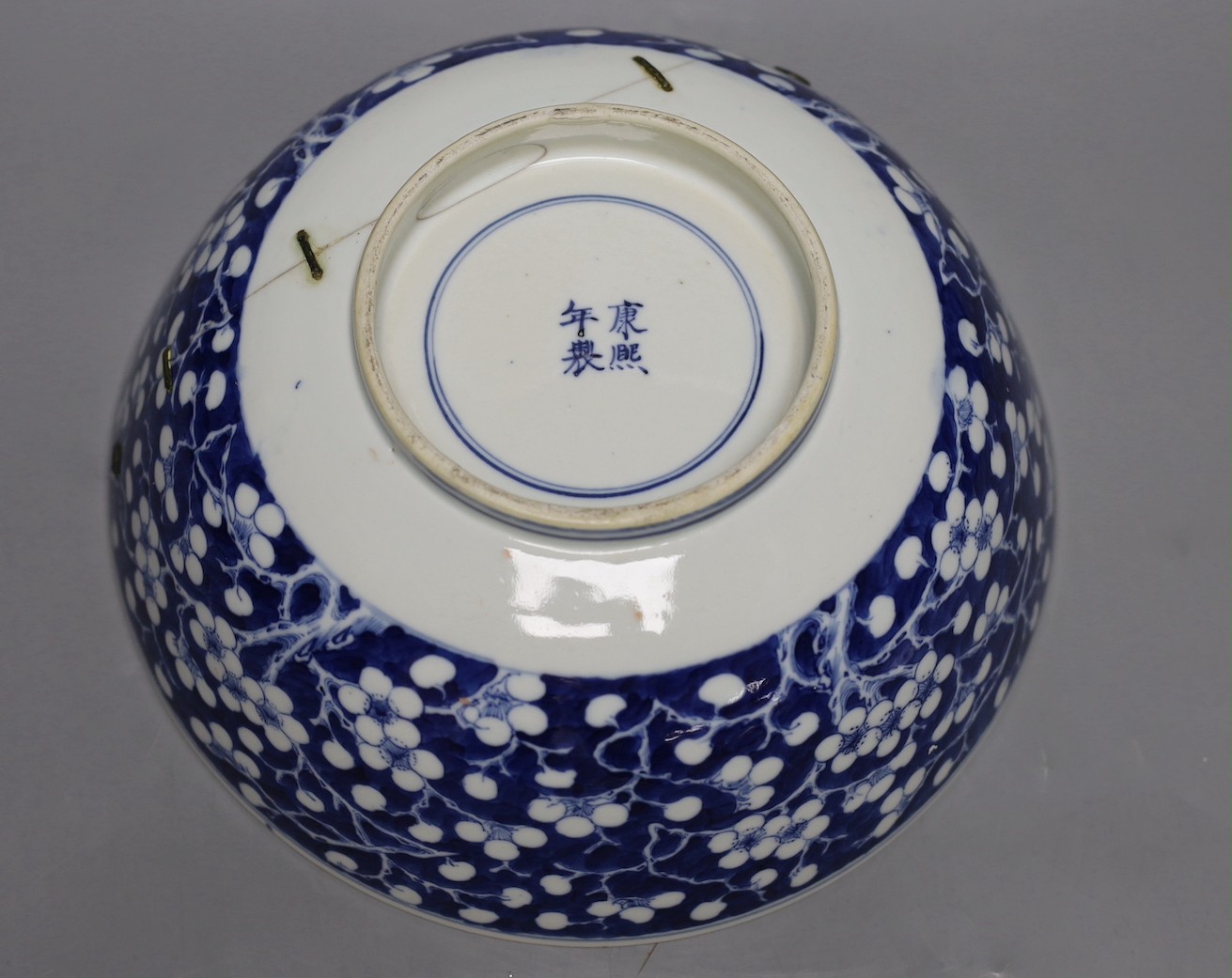 A Chinese blue and white prunus bowl, 19th century. 26.5cm diameter